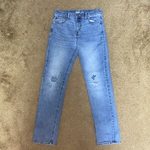 Light wash distressed blue jeans